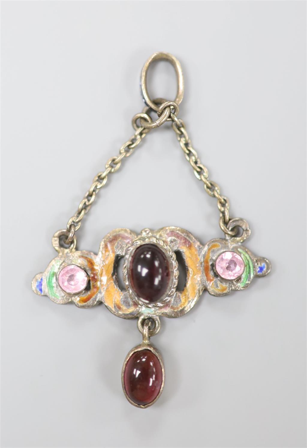 A late 19th century Austro-Hungarian white metal, cabochon garnet, gem and enamel set drop pendant, diameter 32mm.